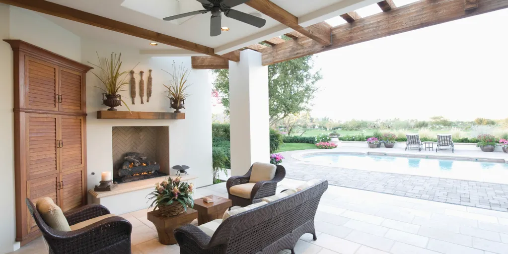 Luxury outdoor patio with fireplace and pool